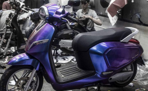 Purple scooter in workshop setting